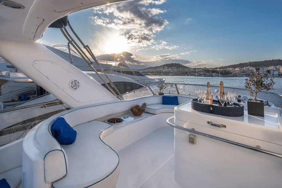 Flybridge seating and wet bar of a Majesty 50 at sunset