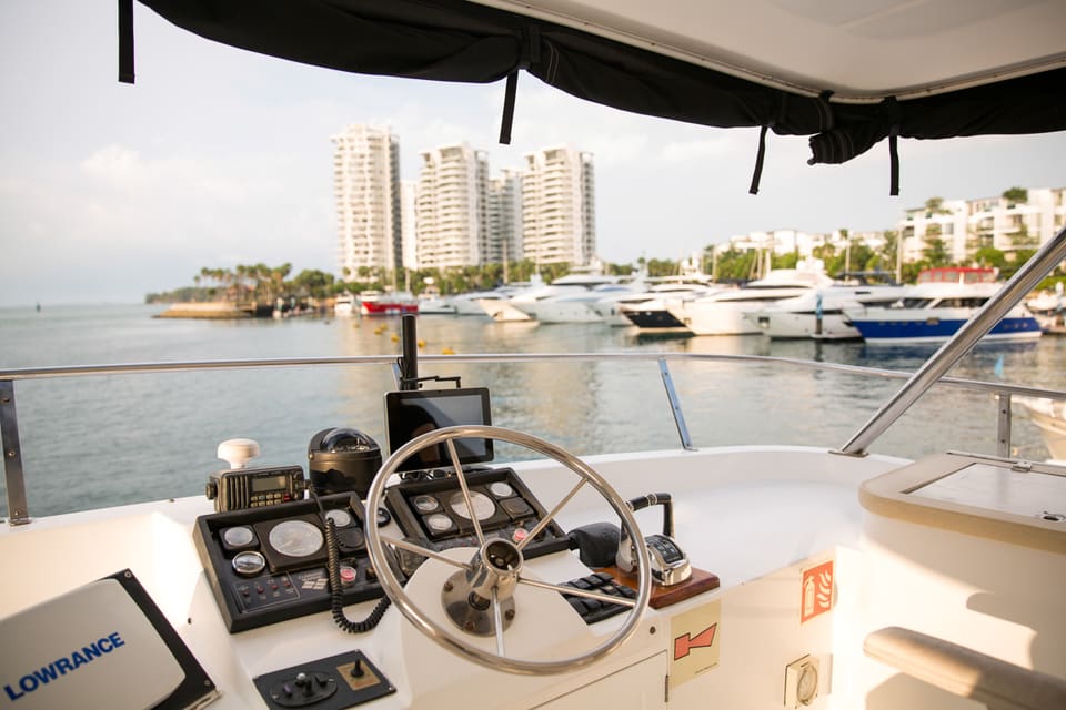 Upper helm on the top deck with the marina and Sentosa Cove behind
