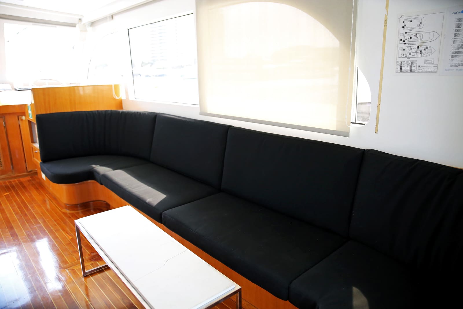 Long padded bench seating along the saloon windows