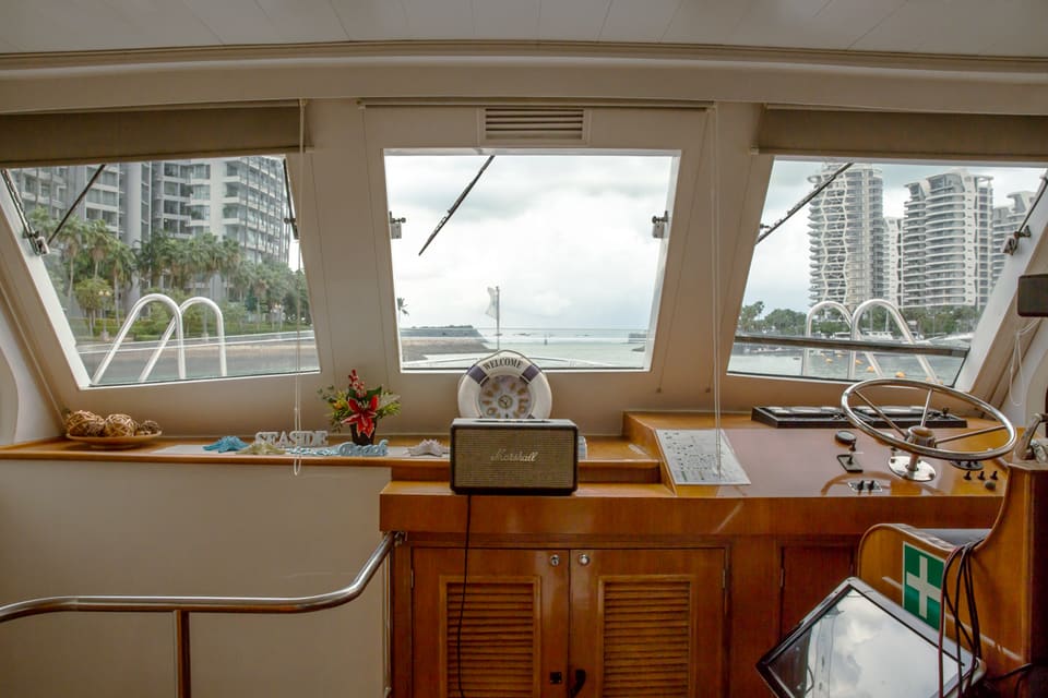 Lower helm and wheelhouse, looking out over the marina